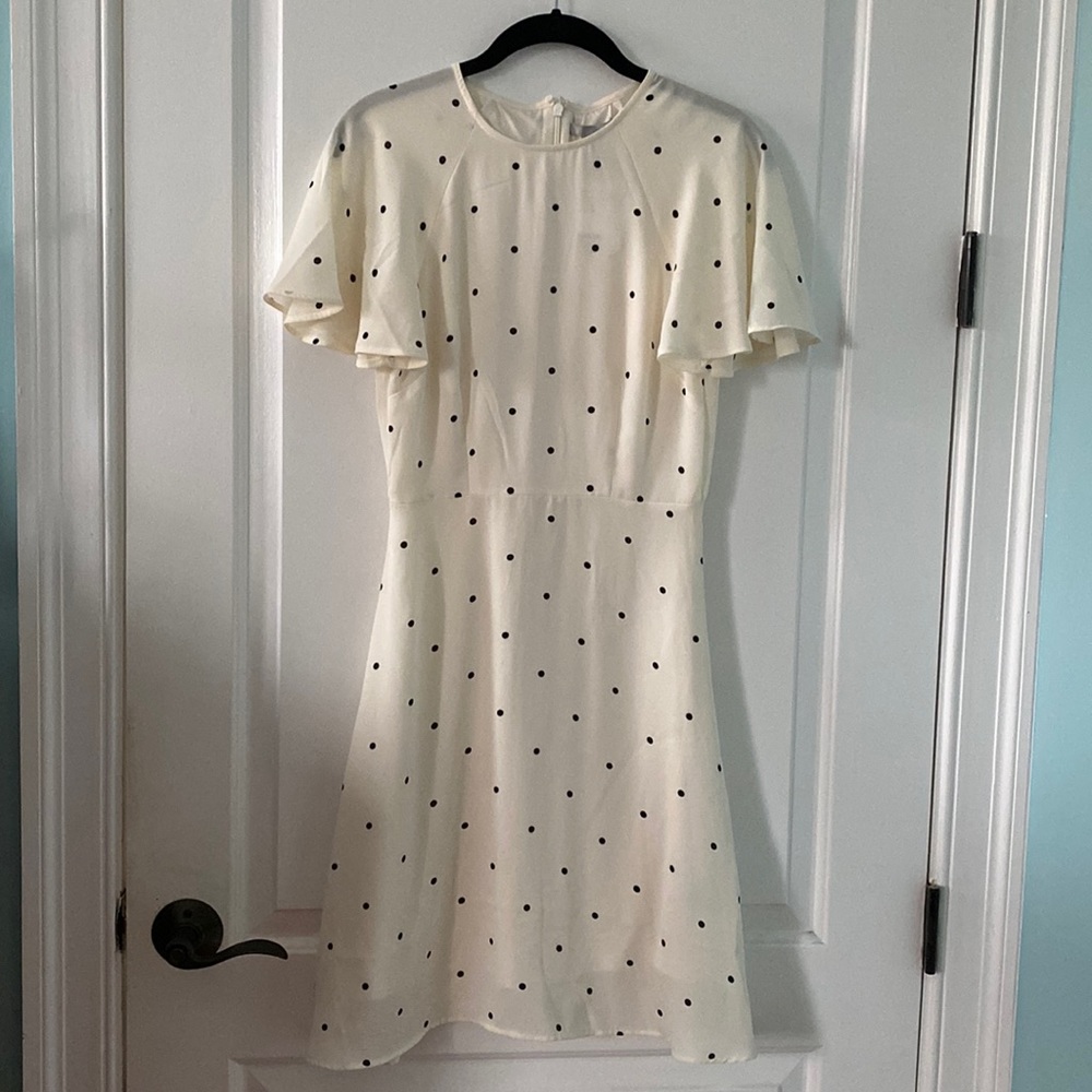 Silky black polka dot on white party dress